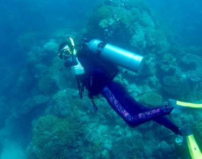 Carson Williams scuba dives at Lady Elliot Island. 