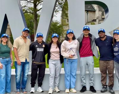 Members of The Electrochemical Society pose in front of CWRU letters. 
