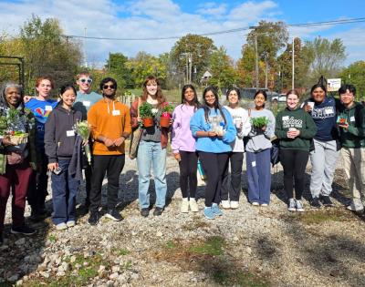 Photo of students volunteering at a local urban farm