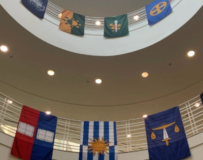 Image of a large stairway area with banners displayed across railings