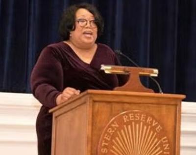 Linda Sharpe-Taylor speaks at a CWRU podium