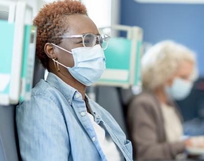 Photo of a patient with a healthcare professional during a cancer clinical trial