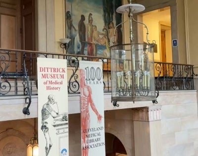 A balcony with banners inside the Allen Memorial Medical Library.