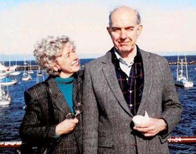 Ann and Dr. James Swinehart standing in front of the water