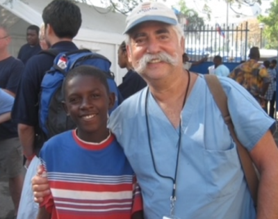 Young man standing next to Dr. Siegel 