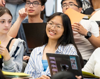 Photo of a student smiling in a classroom at CWRU