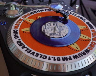 Photo of a WRUW branded turntable in the radio station's studio