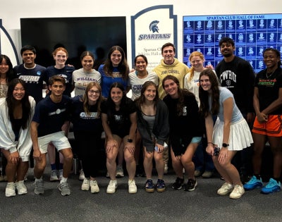 23 students in CWRU AIM posing and smiling together