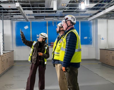 Abigail Mondragon, Philip Polito and Jack Kellogg at the construction site of the Interdisciplinary Science and Engineering Building. Photography by Nancy Andrews.