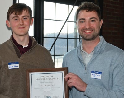 Jacob Akana (pictured left) receives the J. Earl Frazier Memorial Scholarship. 