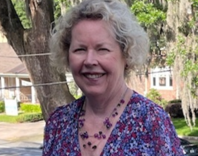 Linda Leatherbury standing outside on beautiful sunny day