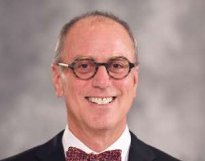 Martin Eichner wearing a bow tie and smiling 