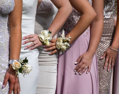 Close up of individuals in prom dresses