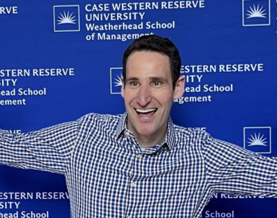 Reid Tileston celebrating after the successful defense of his thesis