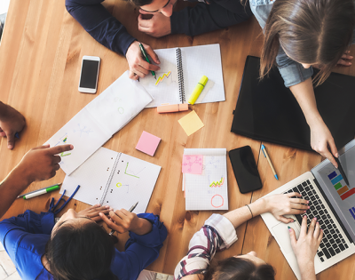 Image of students working together at a table