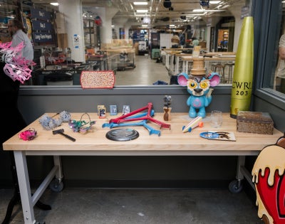 Various painted items on a table at the Sherwin-Williams Paint & Coatings Studio, located at Sears think[box]. 