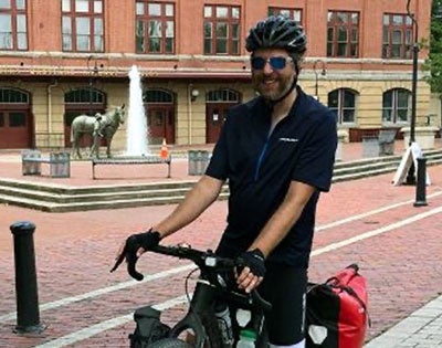 Rob Kollin on a bike on a brick street in Cumberland, Maryland.
