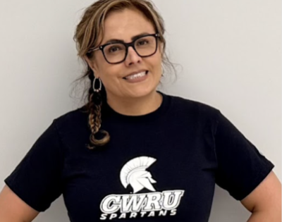 Edith Cabrera poses in a blue Spartans t-shirt