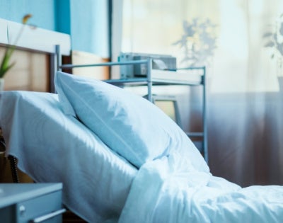 Side view of an empty hospital bed
