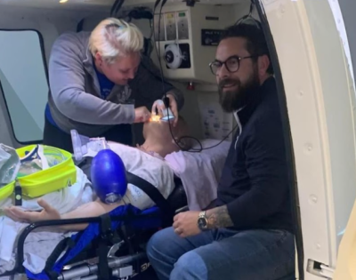 Raquel Dauch and coworker work on a simulation patient on a helicopter.