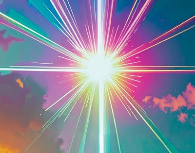 A colorful starburst pattern with multicolored beams emanating from a bright white center against a cloud-filled background.