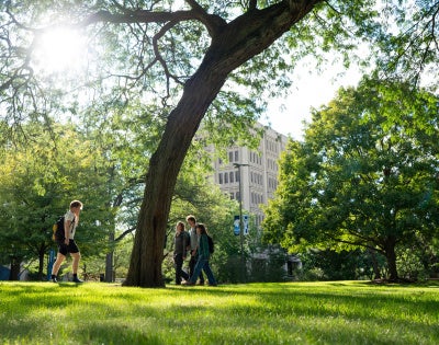 CWRU students walking through Case Quad on a sunny day.