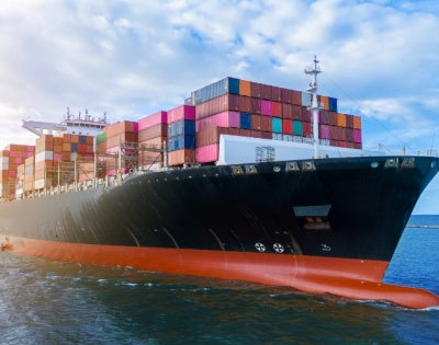 Side view of a loaded cargo ship 