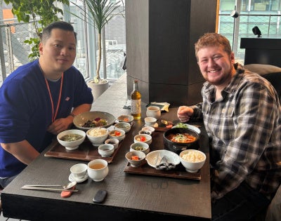 Two men sitting at a restaurant table 