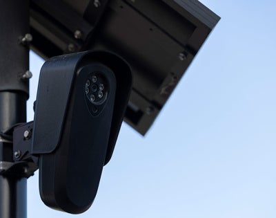 Close up photo of an AI-driven security camera on a post