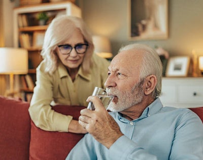 Image of old man drinking water