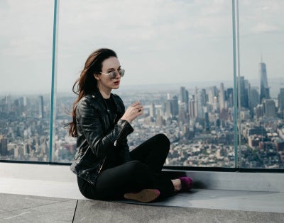 Elizabeth A. Davis with the New York City skyline in the background