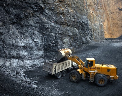 Image of an escavator in a mine site