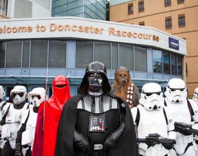 Image of people wearing star wars characters' costumes