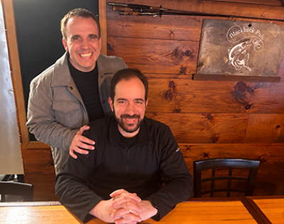 Photo of Adam Paulisick and John Pastor smiling