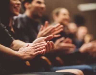 Several people clapping their hands