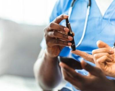 Blood sugar being tested with finger prick