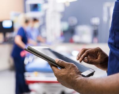 Person holding a tablet