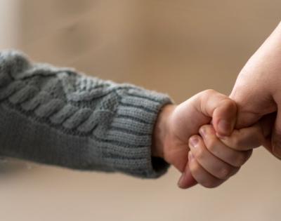child-hand-hold-feat