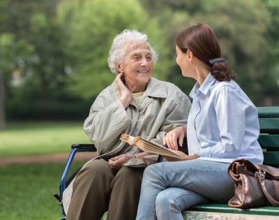 Two women talking on a bench