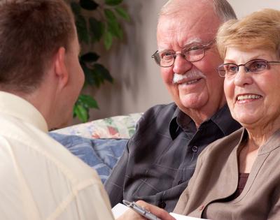 elderly-couple-talking-to-advisor