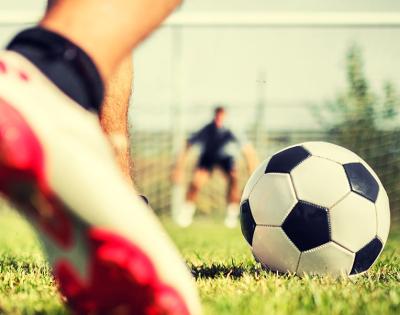 soccer-player-kicking-ball