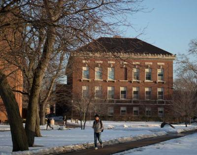student-walking-snow-feat