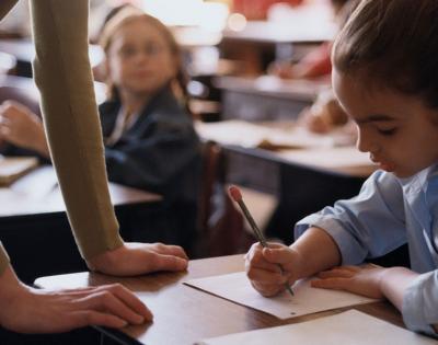 woman-helping-girl-at-school