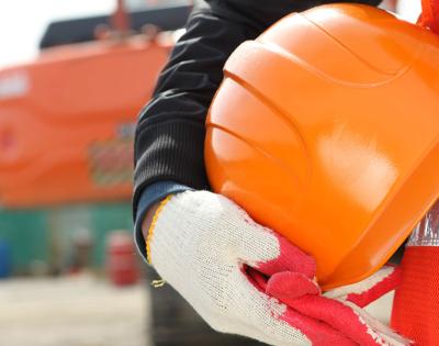 worker-holding-construction-helmet
