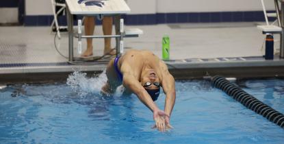 Case Western Reserve University swimmer Emil LaSida does a backstroke start