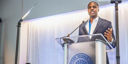 Case Western Reserve University alumnus Kevin Russell speaks at a podium