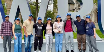 Members of The Electrochemical Society pose in front of CWRU letters. 