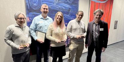 College of Arts and Sciences 2025 Outstanding Staff Award winners pose with their awards
