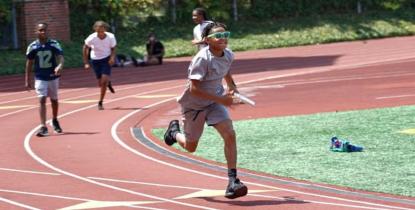 NYSP participants run on a track field