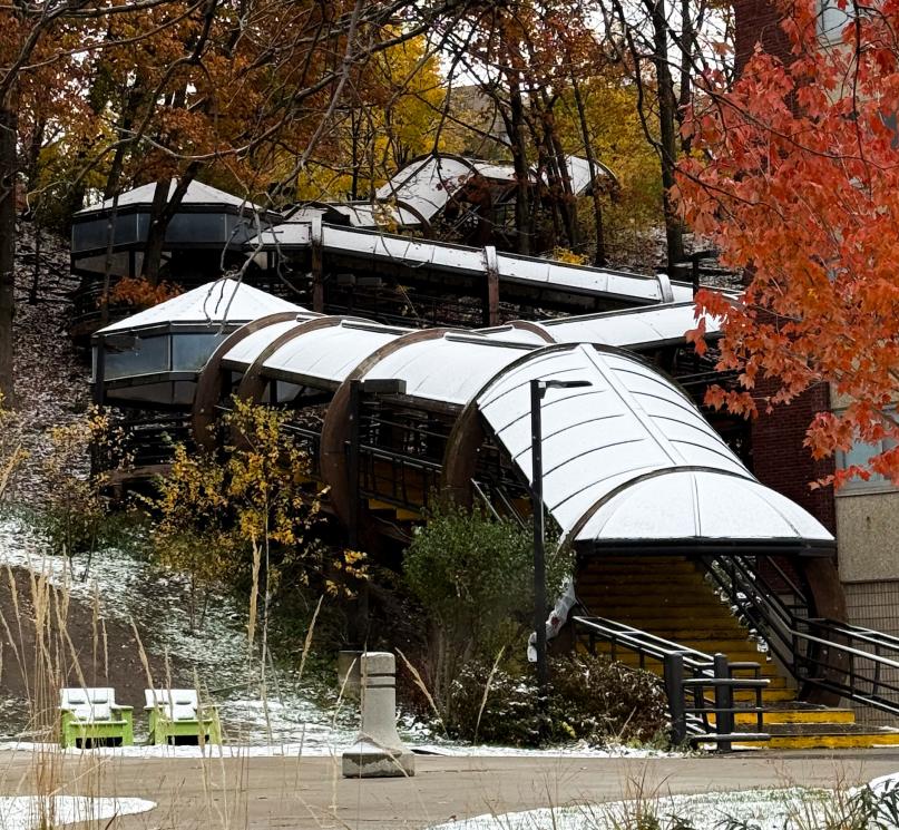 A light layer of snow covering the Elephant Steps and surrounding fall foliage. 